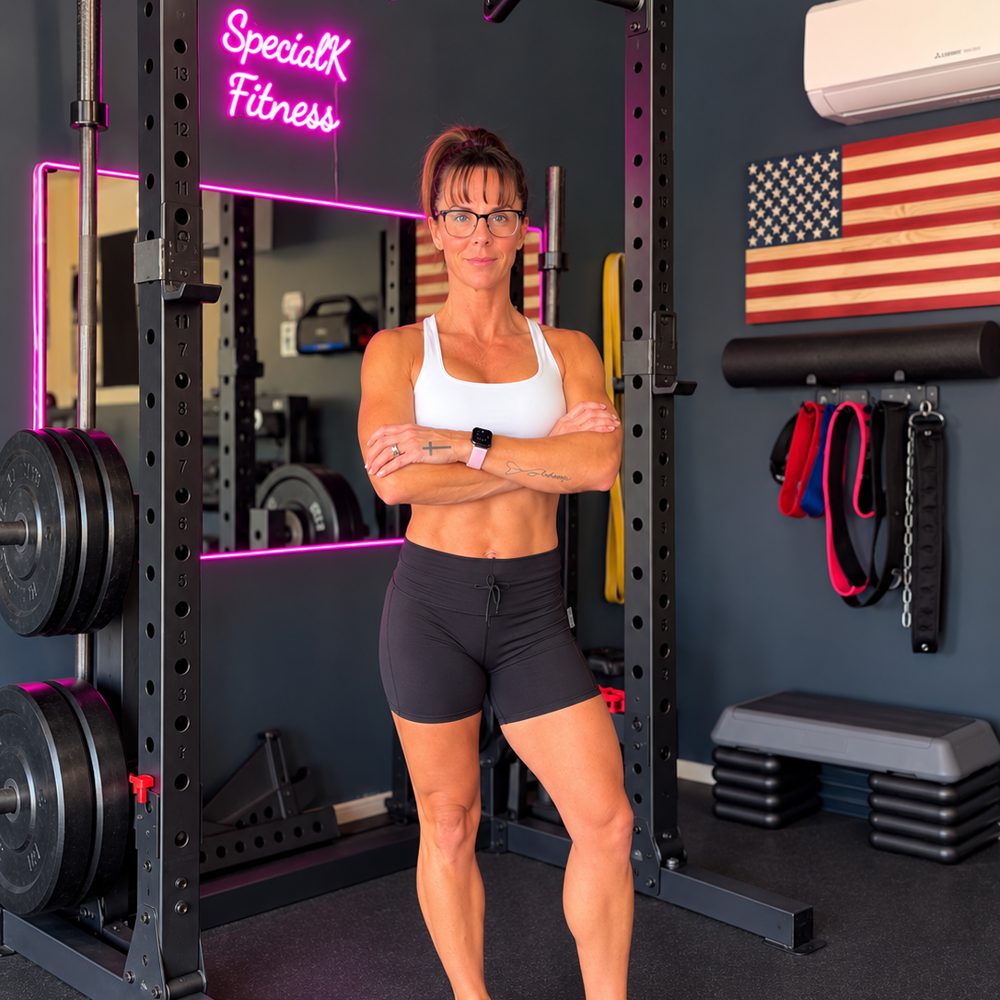 Kelli Anderson standing with arms crossed in her SpecialK Fitness studio